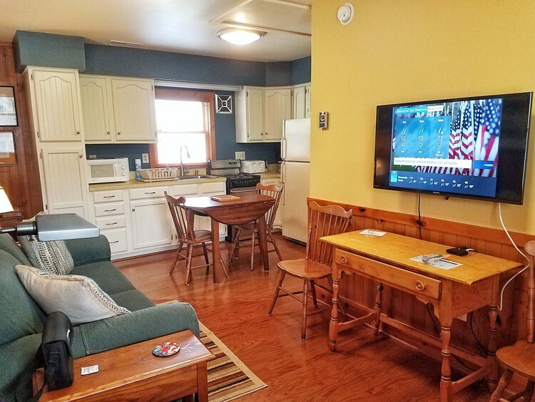 Carriage Town View Jr. Suite Living Area with Cable TV and Full Kitchen for Vacation Rentals